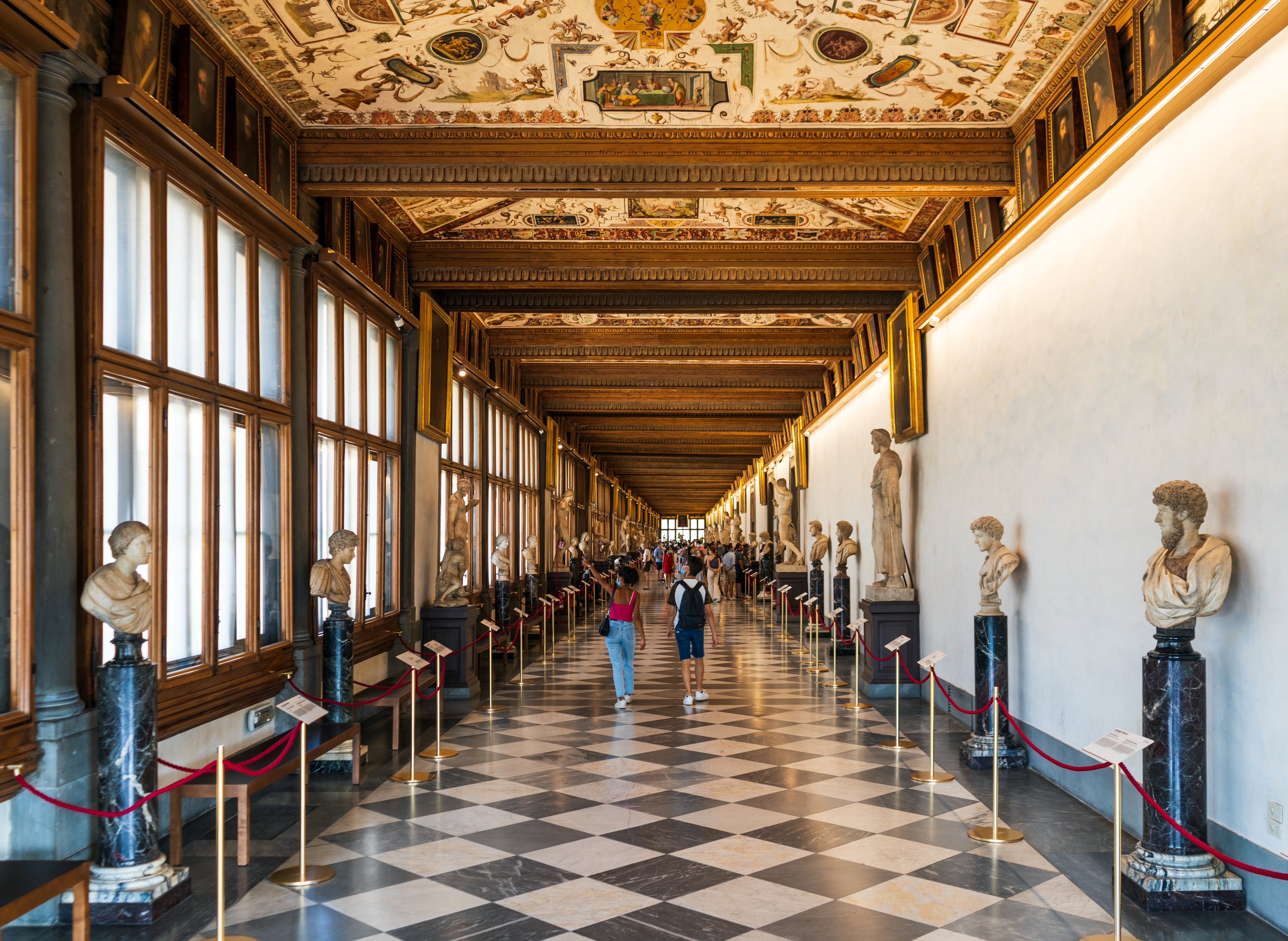 Uffizi Gallery, with statues and tourists, Firenze city center, Tuscany region, Italy